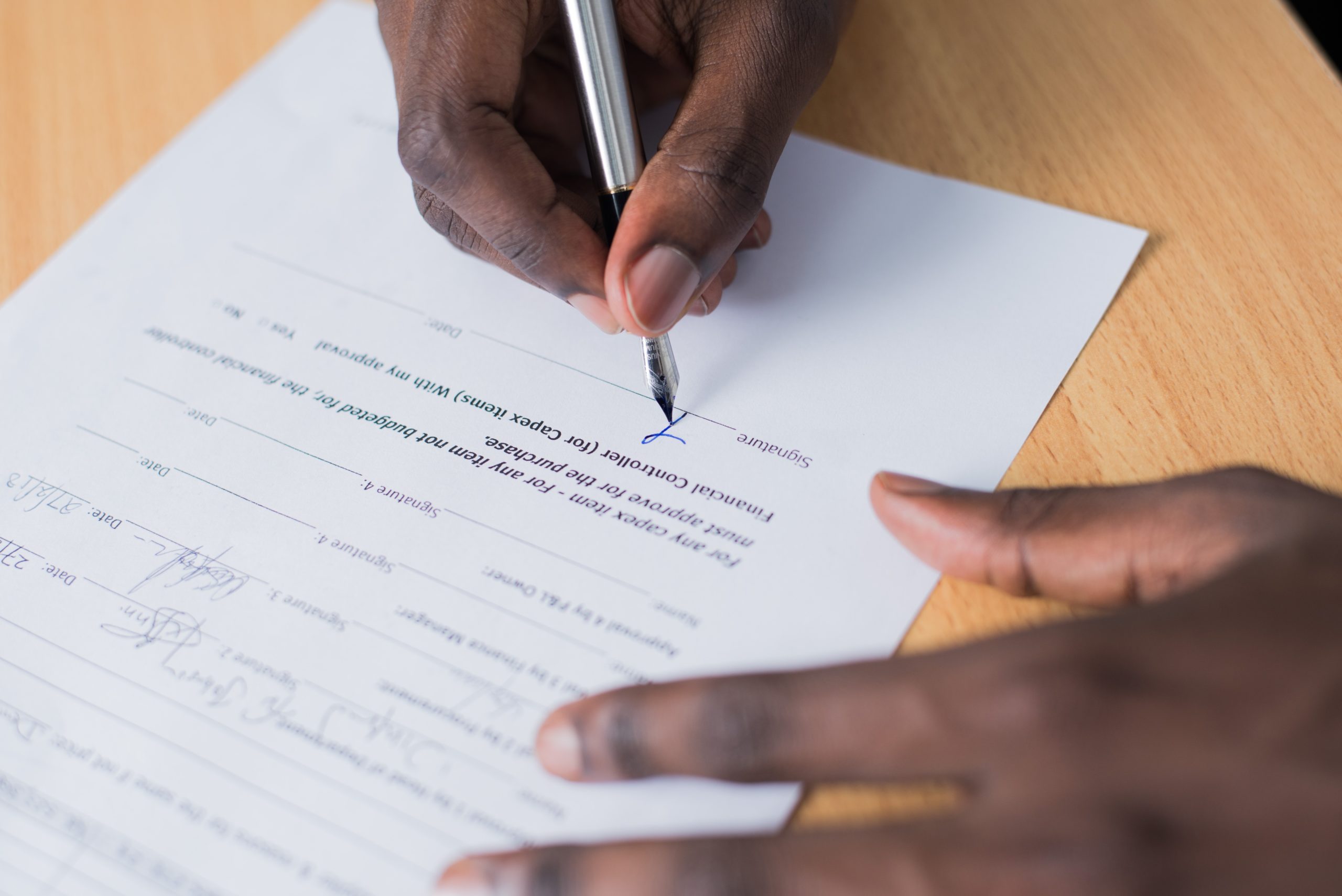 man signing signature