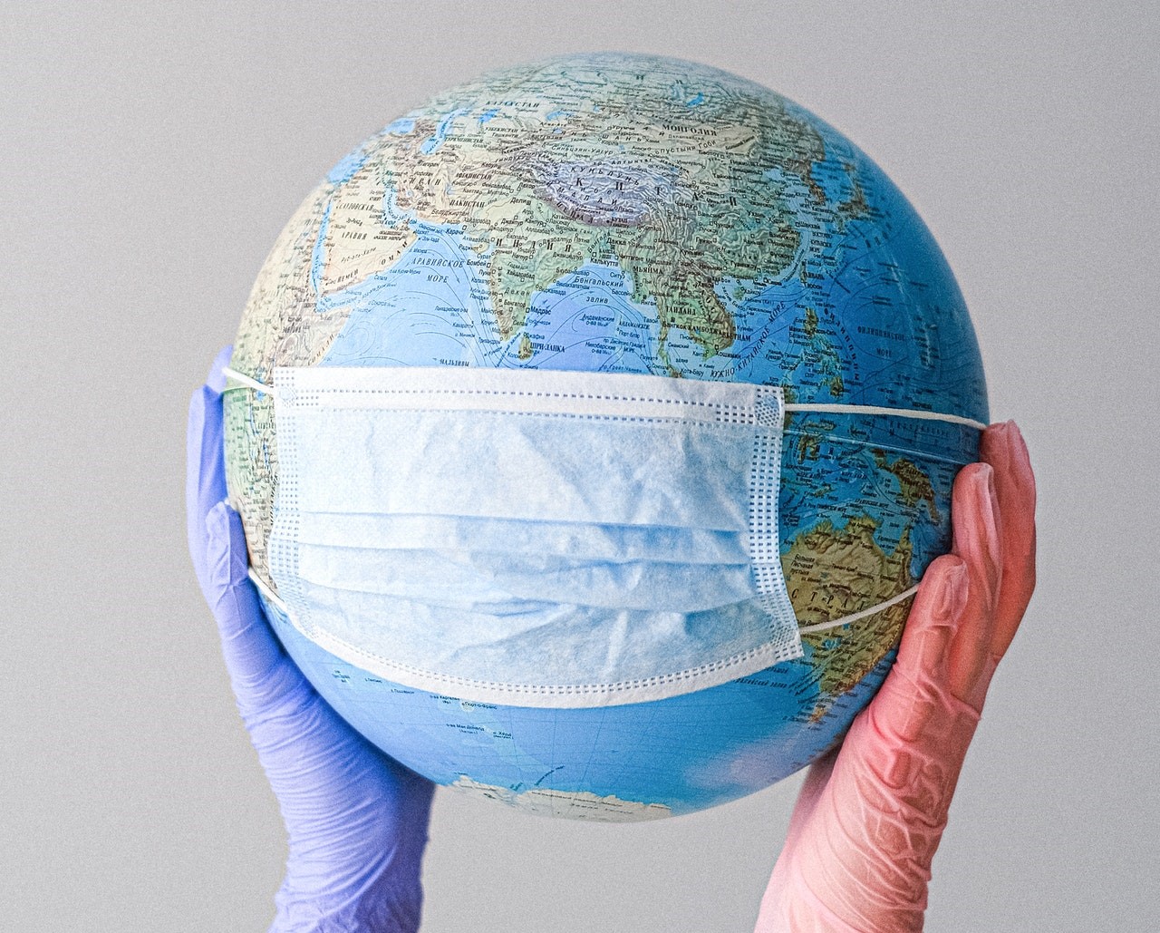 globe with covid mask