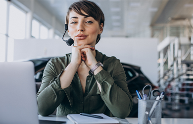 Young woman with headset in office